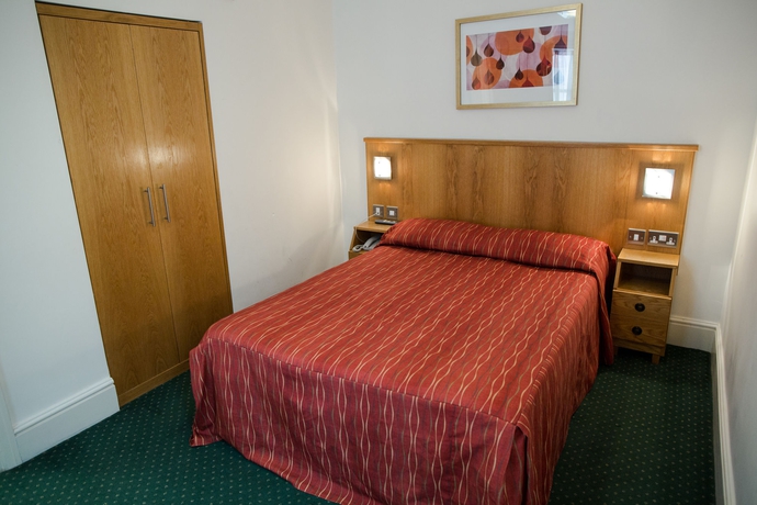 Imagen de la habitación del Hotel QUEENSWAY. Foto 8