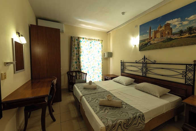 Imagen de la habitación del Hotel Qawra Point Holiday Complex. Foto 8