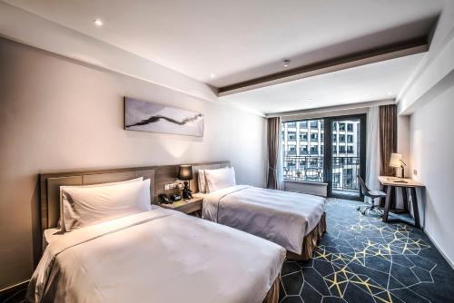 Imagen de la habitación del Hotel Q-box Shanghai Sanjiagang. Foto 10