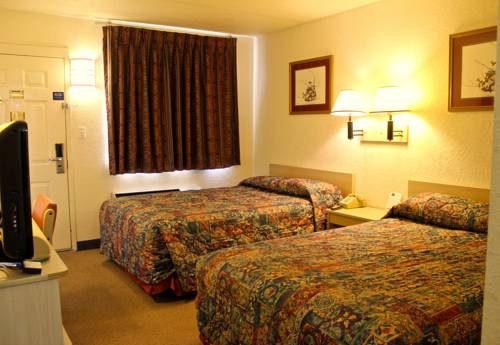Imagen de la habitación del Hotel Qc Stay Inn. Foto 1