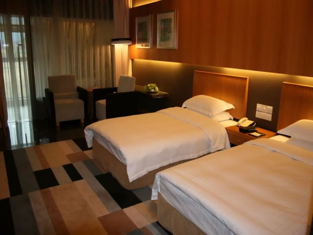 Imagen de la habitación del Hotel Qiandao Lake Country Club Resort. Foto 11