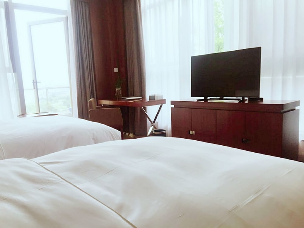 Imagen de la habitación del Hotel Qiandao Lake Country Club Resort. Foto 14
