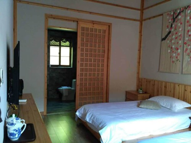 Imagen de la habitación del Hotel Qiandaohu Liyuan Village Botique Hotel. Foto 9