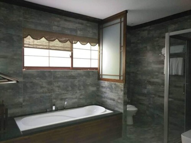 Imagen de la habitación del Hotel Qiandaohu Liyuan Village Botique Hotel. Foto 11