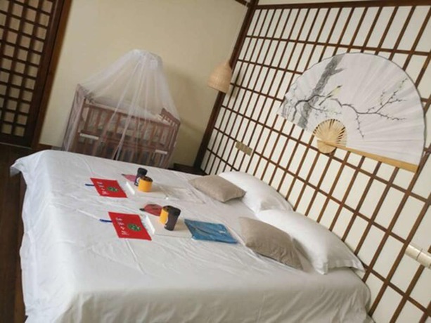 Imagen de la habitación del Hotel Qiandaohu Liyuan Village Botique Hotel. Foto 12