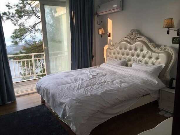 Imagen de la habitación del Hotel Qiandaohu Luxury Lake View Villa. Foto 7