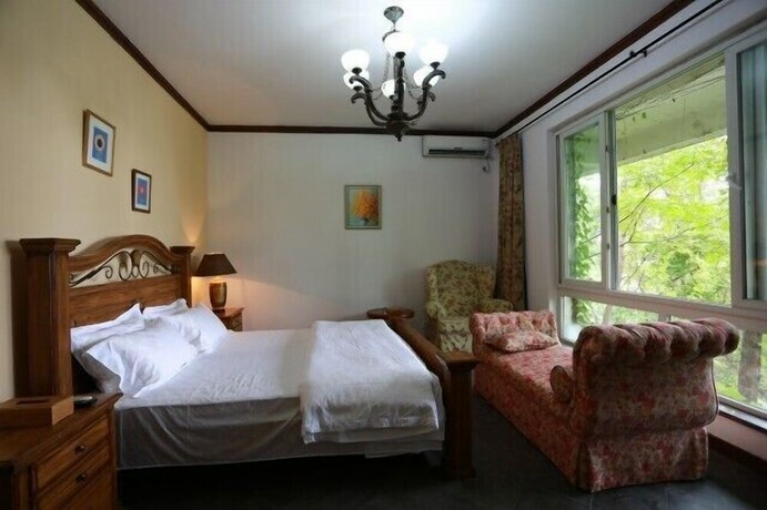 Imagen de la habitación del Hotel Qiandaohu Our Relax Villa. Foto 38