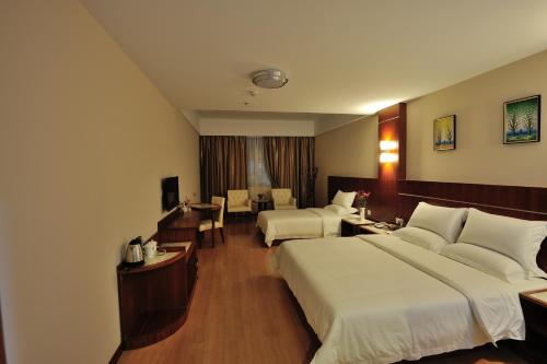 Imagen de la habitación del Hotel Qiang Wei Business. Foto 7