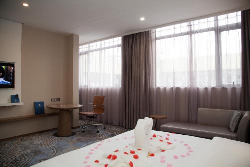 Imagen de la habitación del Hotel Qianhai Holiday. Foto 7
