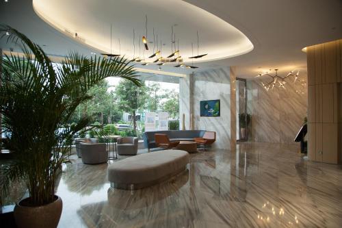 Imagen de la habitación del Hotel Qianhai Holiday. Foto 8
