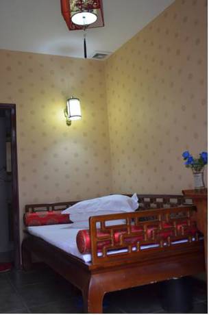Imagen de la habitación del Hotel Qianmen Courtyard. Foto 7