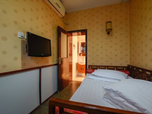 Imagen de la habitación del Hotel Qianmen Courtyard. Foto 8