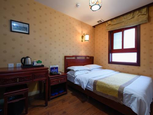 Imagen de la habitación del Hotel Qianmen Courtyard. Foto 10