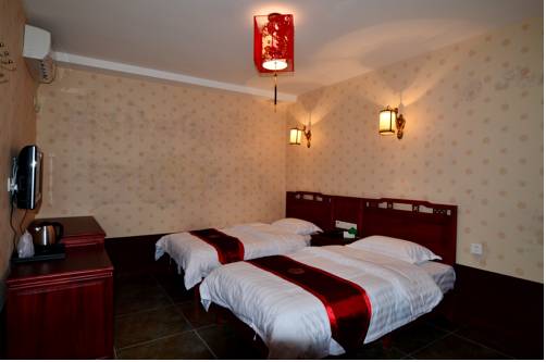 Imagen de la habitación del Hotel Qianmen Courtyard. Foto 12