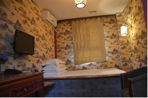 Imagen de la habitación del Hotel Qianmen Courtyard. Foto 13