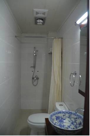 Imagen de la habitación del Hotel Qianmen Courtyard. Foto 15