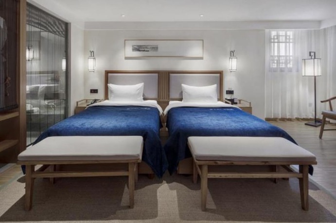 Imagen de la habitación del Hotel Qianna Bianyuan Hotel. Foto 4