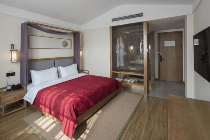 Imagen de la habitación del Hotel Qianna Bianyuan Hotel. Foto 6