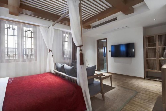 Imagen de la habitación del Hotel Qianna Bianyuan Hotel. Foto 7