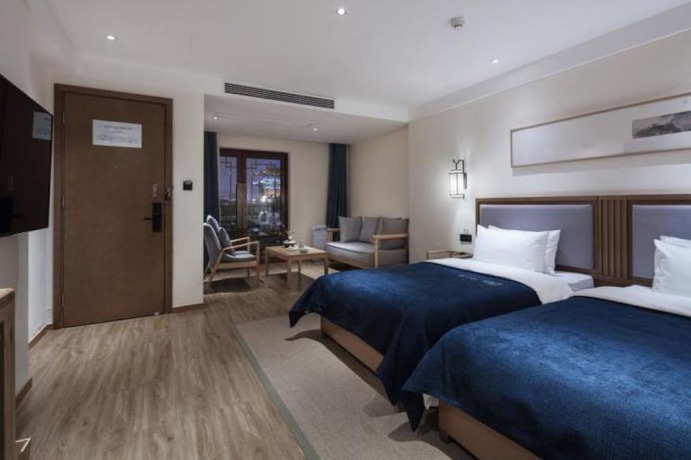 Imagen de la habitación del Hotel Qianna Bianyuan Hotel. Foto 8