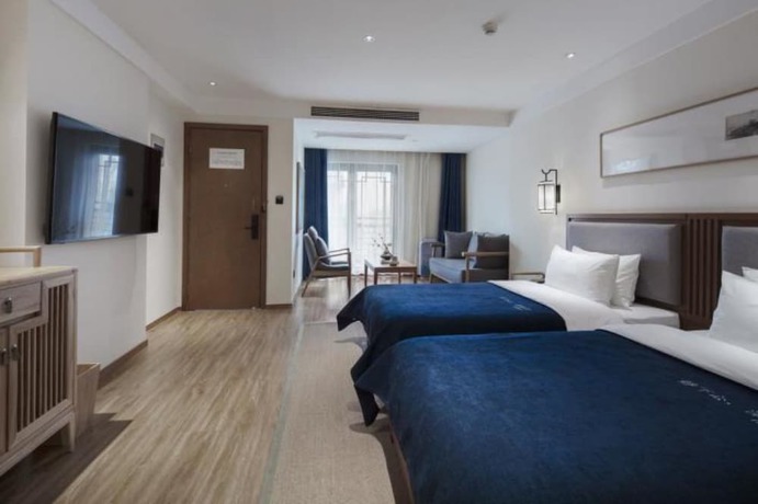 Imagen de la habitación del Hotel Qianna Bianyuan Hotel. Foto 9