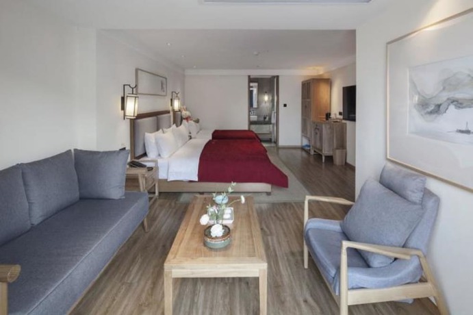 Imagen de la habitación del Hotel Qianna Bianyuan Hotel. Foto 10