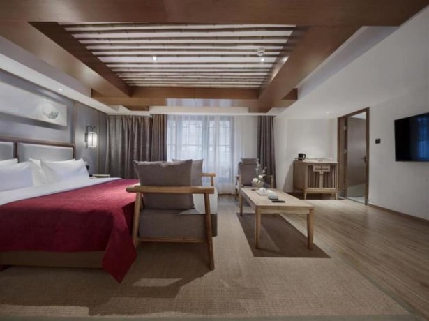 Imagen de la habitación del Hotel Qianna Bianyuan Hotel. Foto 12