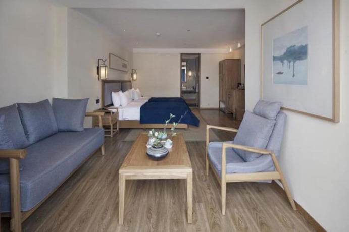 Imagen de la habitación del Hotel Qianna Bianyuan Hotel. Foto 13