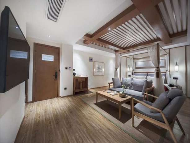 Imagen de la habitación del Hotel Qianna Bianyuan Hotel. Foto 14