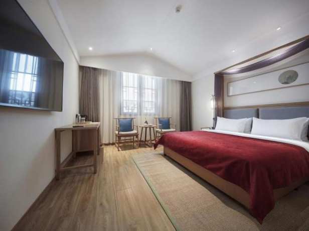 Imagen de la habitación del Hotel Qianna Bianyuan Hotel. Foto 15