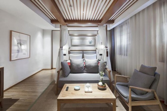 Imagen de la habitación del Hotel Qianna Bianyuan Hotel. Foto 16