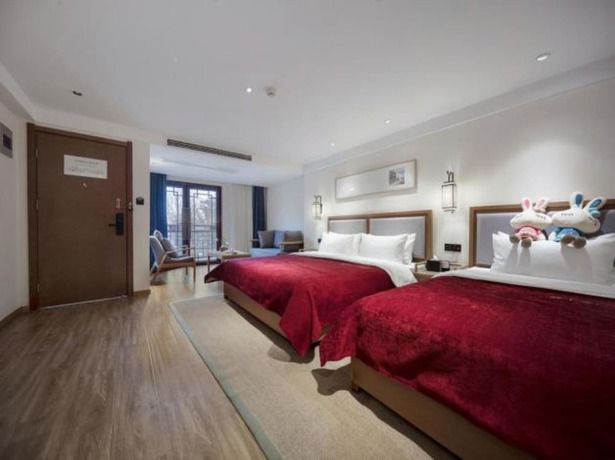 Imagen de la habitación del Hotel Qianna Bianyuan Hotel. Foto 17