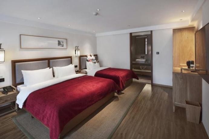 Imagen de la habitación del Hotel Qianna Bianyuan Hotel. Foto 18