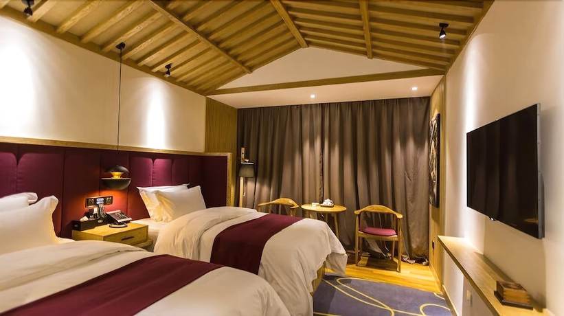 Imagen de la habitación del Hotel Qianna Chengji Hotel. Foto 4