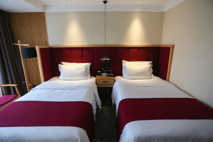 Imagen de la habitación del Hotel Qianna Chengji Hotel. Foto 5