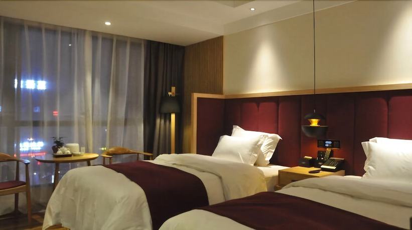 Imagen de la habitación del Hotel Qianna Chengji Hotel. Foto 11