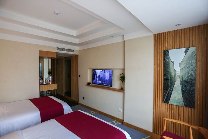 Imagen de la habitación del Hotel Qianna Chengji Hotel. Foto 13