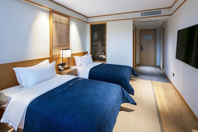 Imagen de la habitación del Hotel Qianna Yingtang Hotel. Foto 10