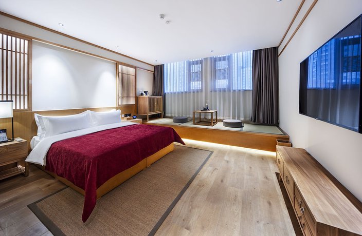 Imagen de la habitación del Hotel Qianna Yingtang Hotel. Foto 11