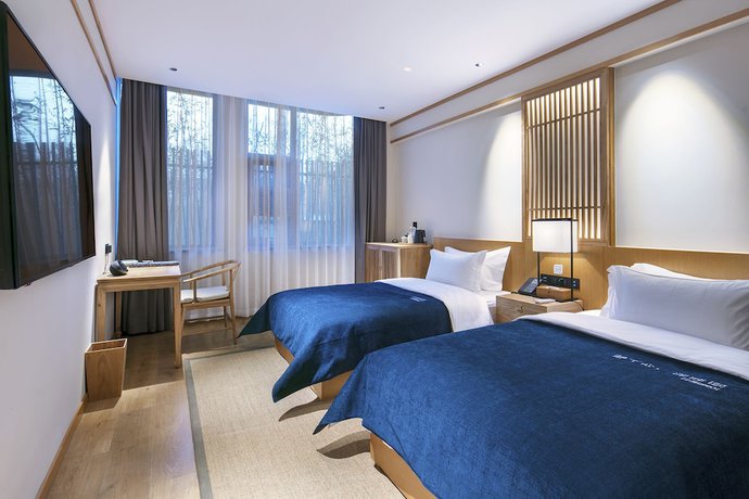 Imagen de la habitación del Hotel Qianna Yingtang Hotel. Foto 14