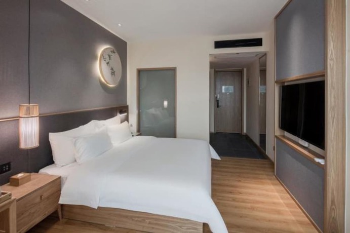 Imagen de la habitación del Hotel Qianna Zhengzhou Huayuan North Road Branch. Foto 5