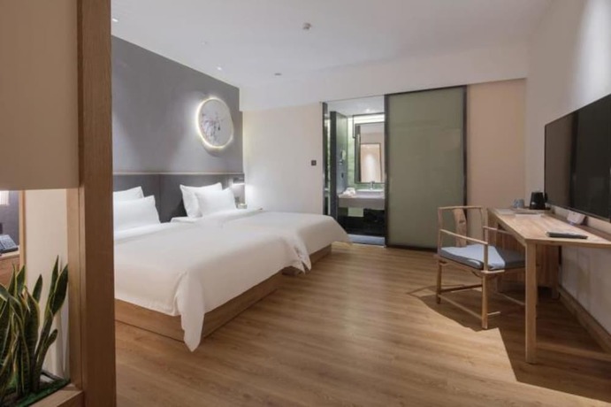 Imagen de la habitación del Hotel Qianna Zhengzhou Huayuan North Road Branch. Foto 8