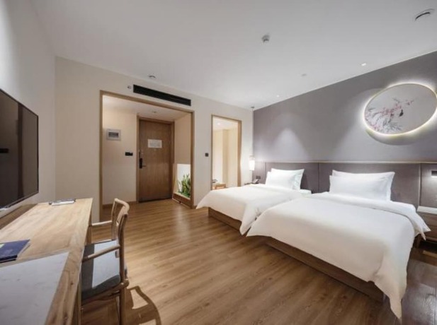 Imagen de la habitación del Hotel Qianna Zhengzhou Huayuan North Road Branch. Foto 9