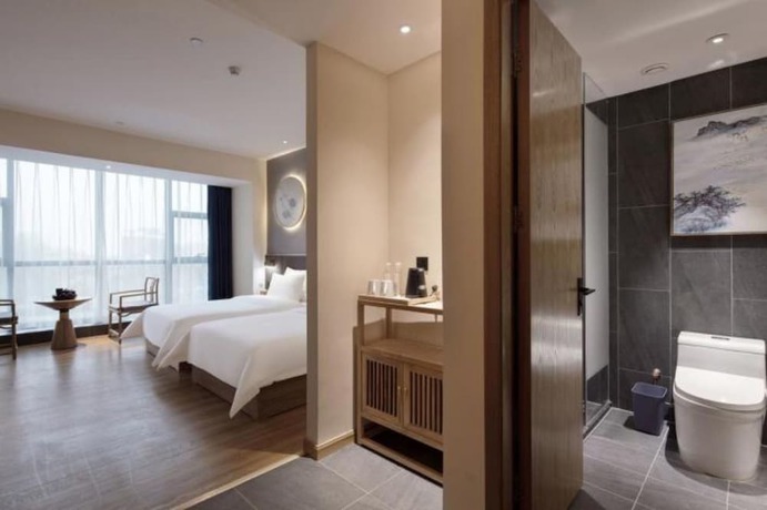 Imagen de la habitación del Hotel Qianna Zhengzhou Huayuan North Road Branch. Foto 11