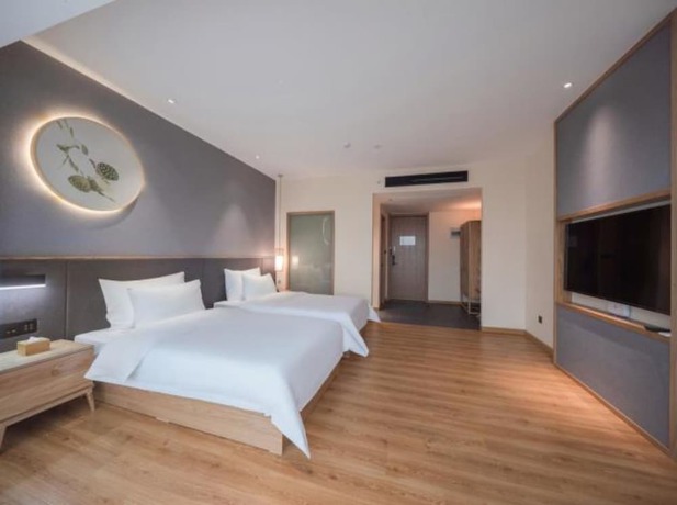 Imagen de la habitación del Hotel Qianna Zhengzhou Huayuan North Road Branch. Foto 12