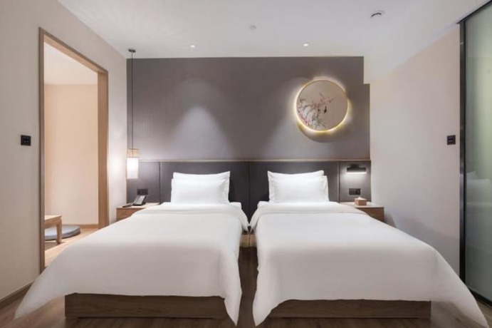 Imagen de la habitación del Hotel Qianna Zhengzhou Huayuan North Road Branch. Foto 13