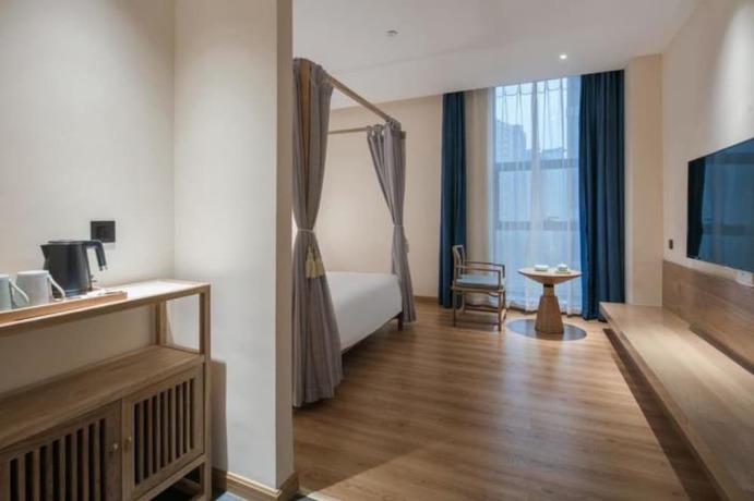 Imagen de la habitación del Hotel Qianna Zhengzhou Huayuan North Road Branch. Foto 15