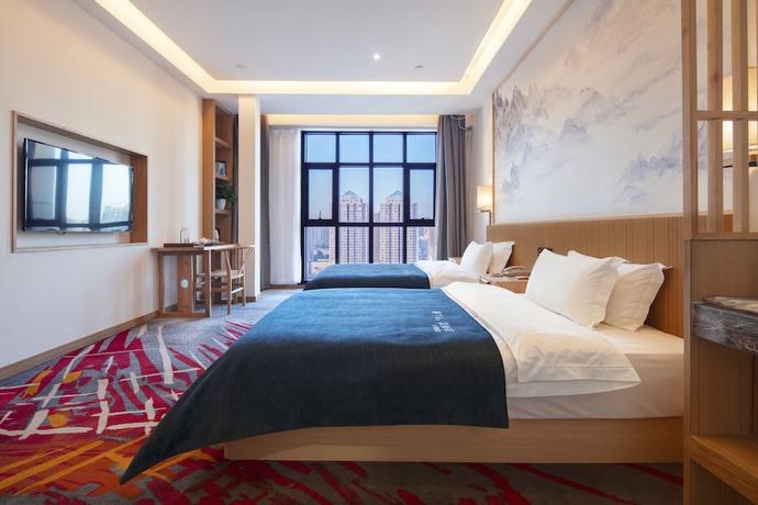 Imagen de la habitación del Hotel Qianna Zhengzhou Jingguang Road. Foto 5