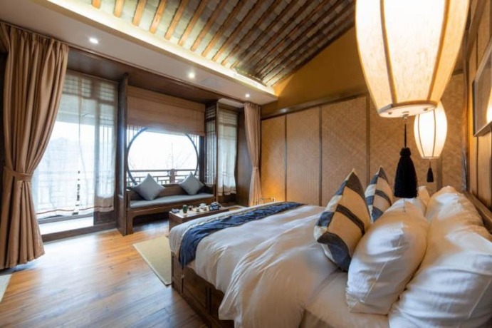 Imagen de la habitación del Hotel Qiansu Ban Jiang Xia Boutique Inn. Foto 22