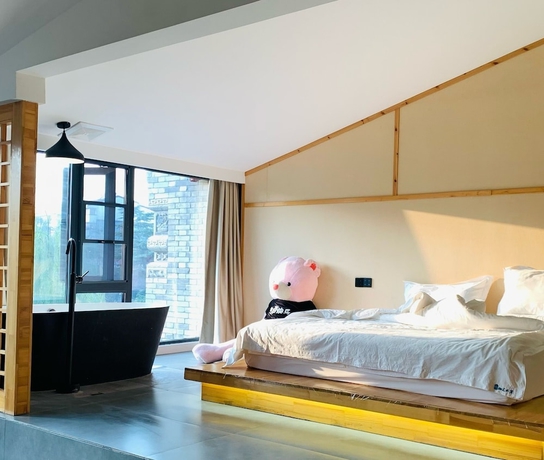 Imagen de la habitación del Hotel Qichi Waterfront BandB. Foto 10